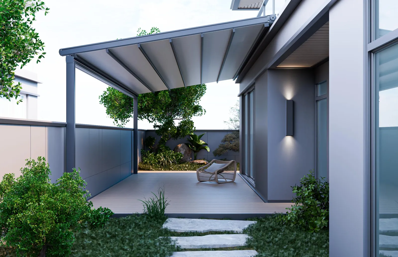 Charcoal electric folding pergola with white PVC roof extended over a timber deck beside a modern home